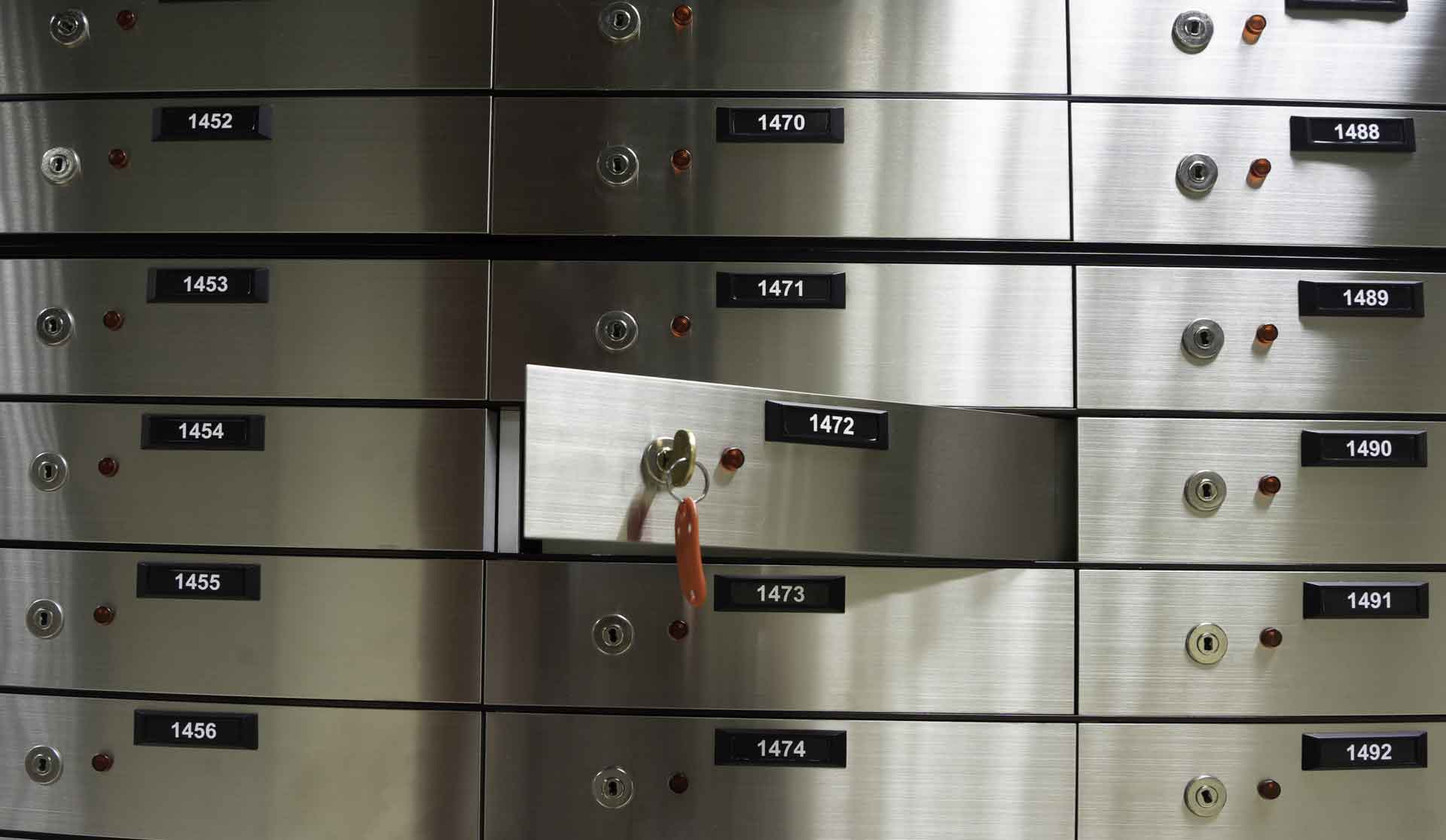 Wall of stainless steel safe deposit boxes with key